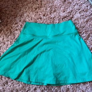 Green crossover tennis skirt
